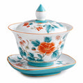 Teetasse mit Deckel und Untertasse, Blumenmuster, Weiß/Türkis/Orange